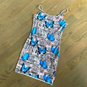 Slip dress with butterfly and newspaper print